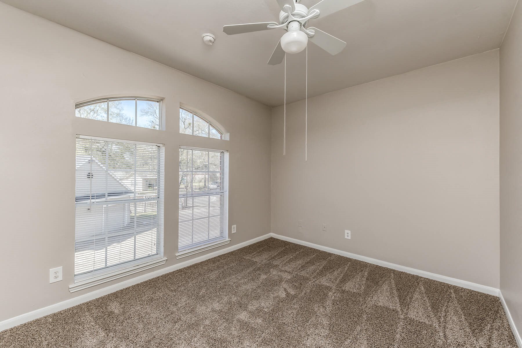 Bedroom with large window at Hollow Creek in Conroe TX